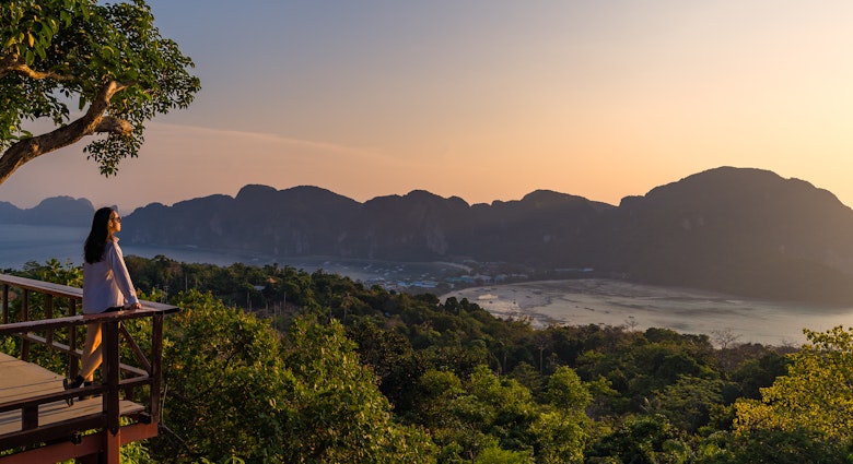 A woman standing at Phi Phi View Point And see the view from a bird's eye view of the mountains, the sea and the sunset. and town on Phi Phi Island, Krabi Province, Thailand
1474089369
A woman standing at Phi Phi View Point with a bird's eye view of the mountains, the sea and the sunset on Phi Phi Island, Krabi Province, Thailand